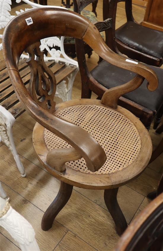 A Victorian caned desk chair